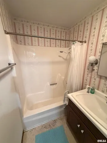 a bathroom with a sink and a shower