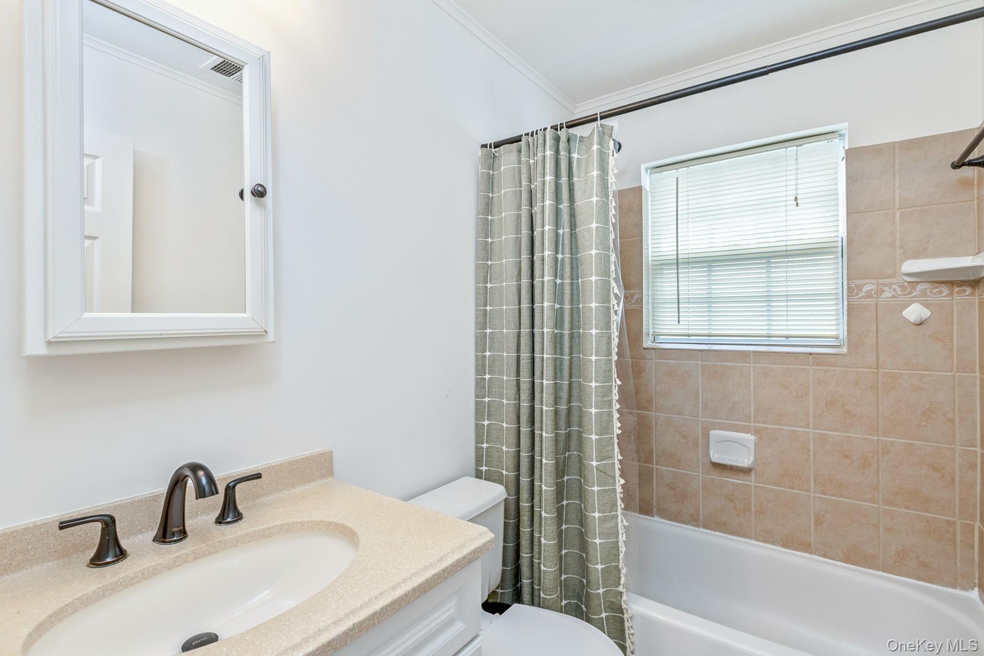 7 Possum Path Coram, NY 11727 - Photo 15 of 22 a bathroom with a sink and a mirror