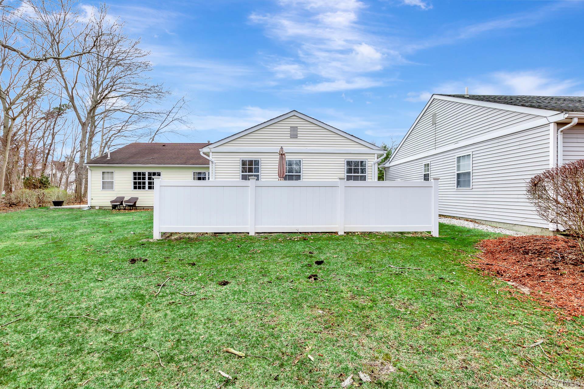 7 Possum Path Coram, NY 11727 - Photo 16 of 22 a view of a house with yard and a garden