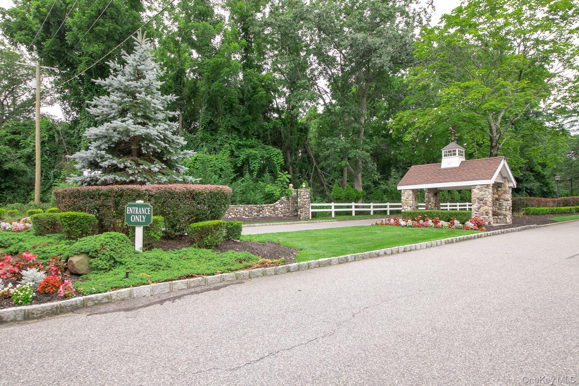 7 Possum Path Coram, NY 11727 - Photo 18 of 22 a front view of a house with yard and green space