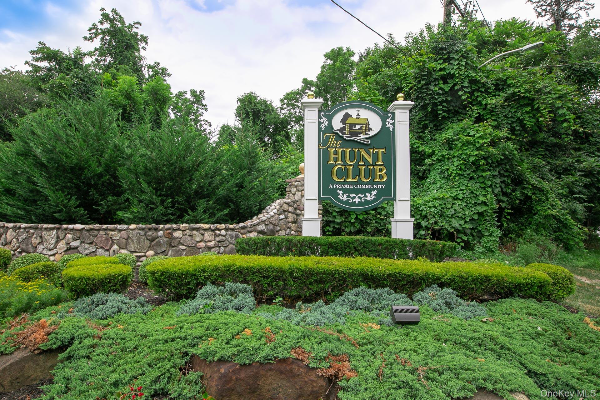 7 Possum Path Coram, NY 11727 - Photo 2 of 22 a sign board with a big yard and large trees