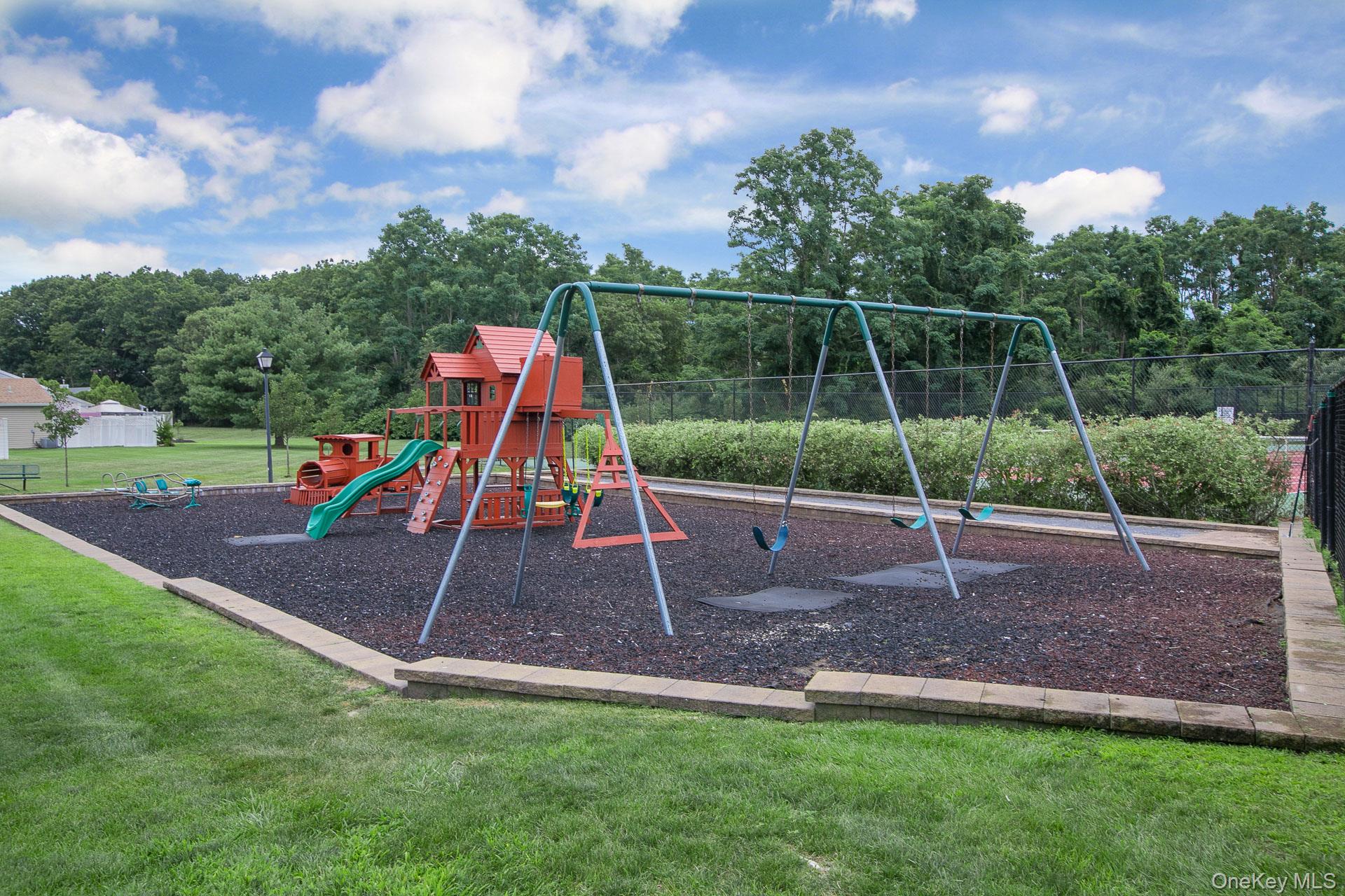 7 Possum Path Coram, NY 11727 - Photo 21 of 22 a view of outdoor space with playground and green space