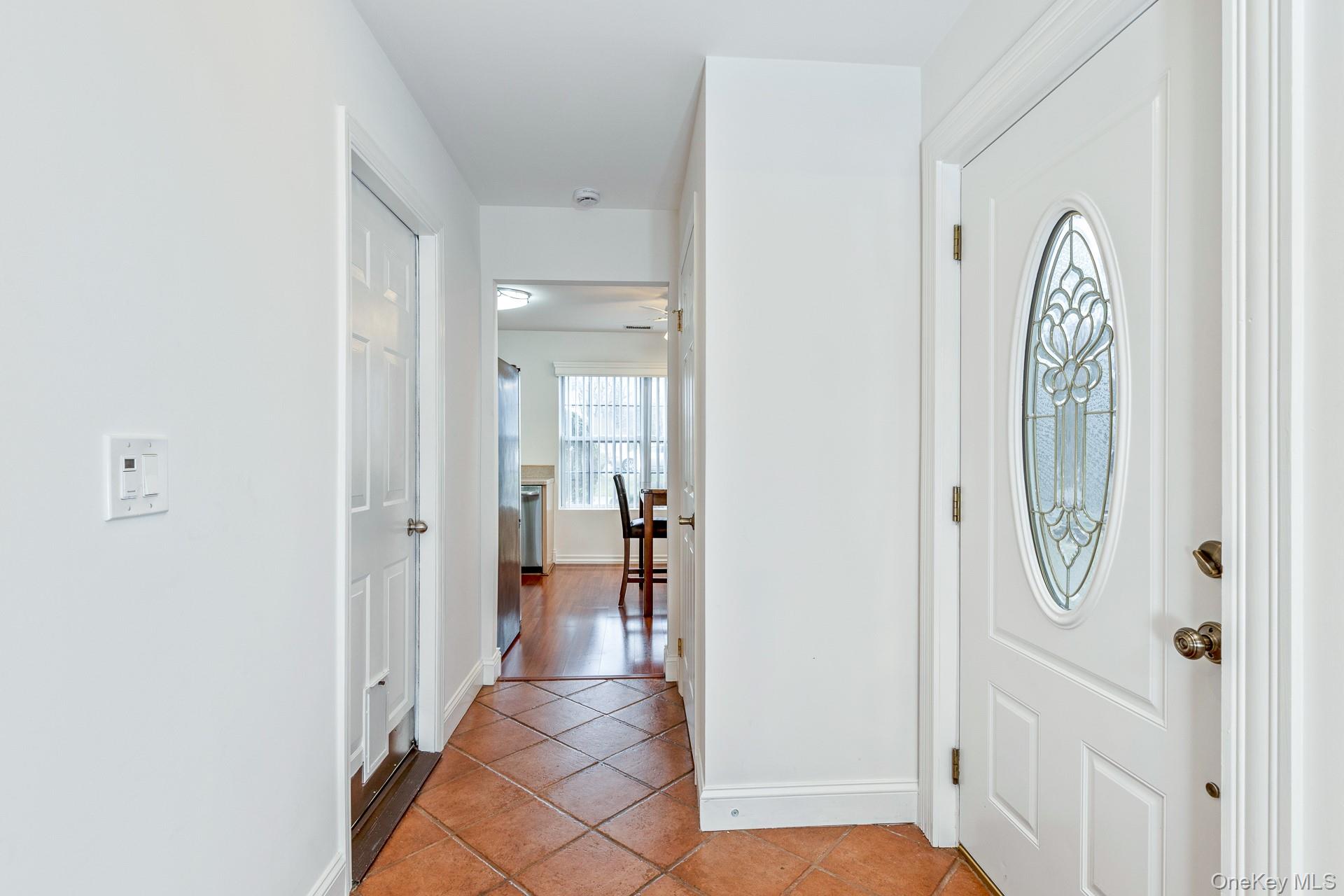 7 Possum Path Coram, NY 11727 - Photo 5 of 22 a view of a hallway with windows and closet