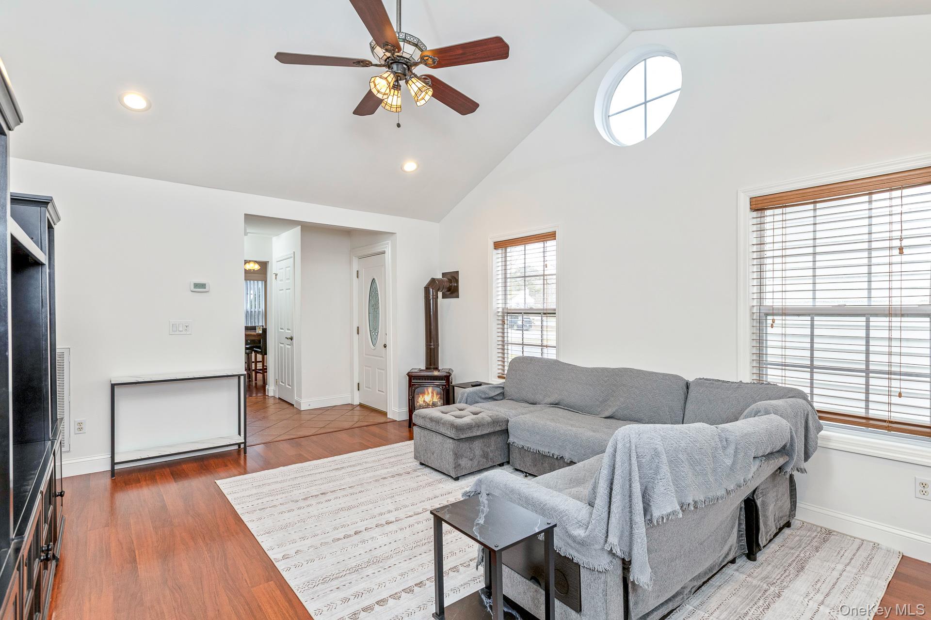 7 Possum Path Coram, NY 11727 - Photo 7 of 22 a living room with furniture and a wooden floor