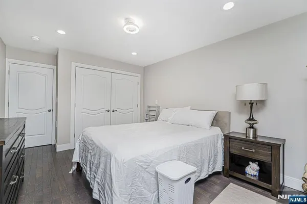 a bedroom with a bed and a lamp