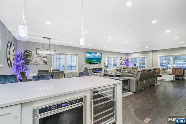 a view of a living room and kitchen