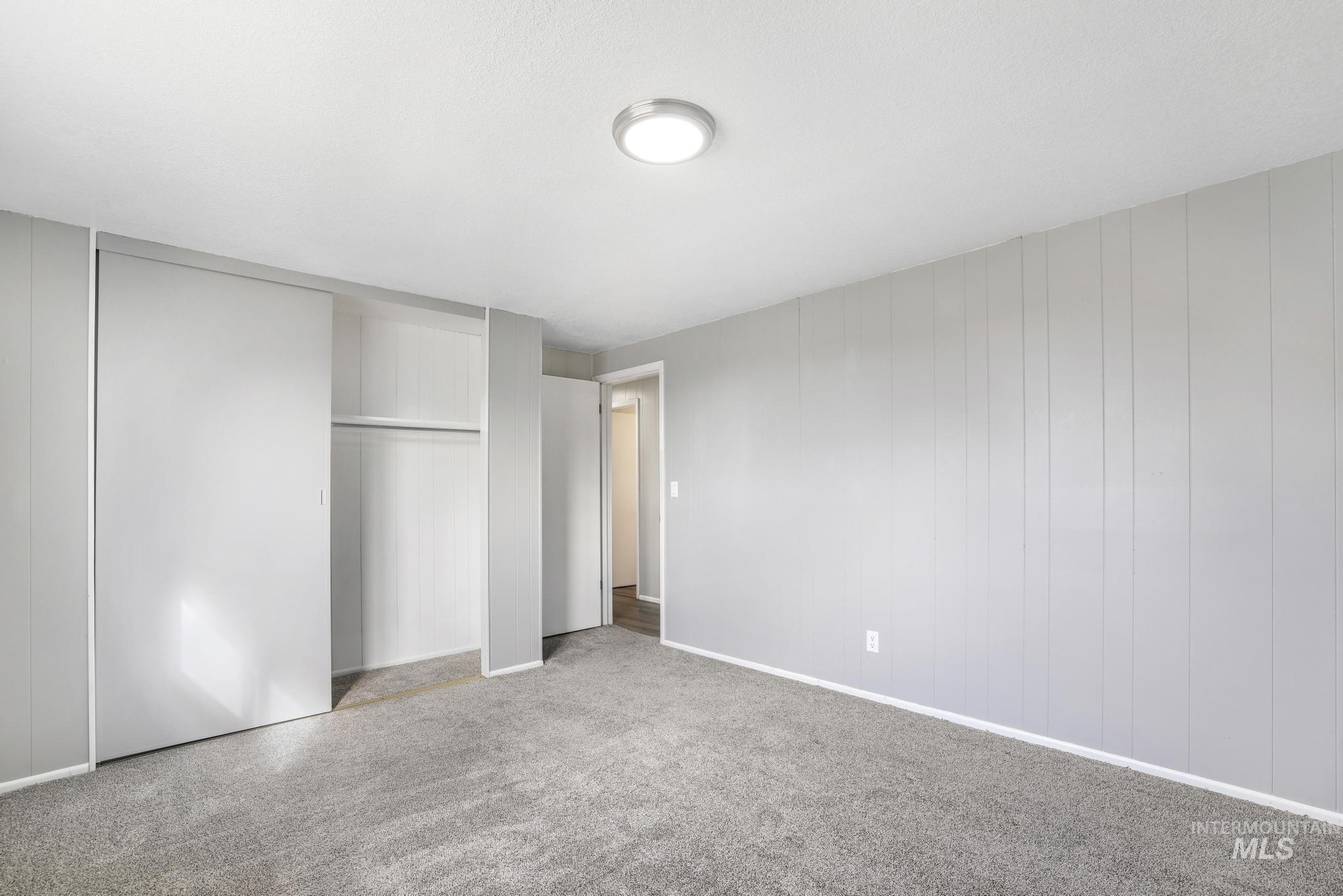 1840 V Street Heyburn, ID 83336 - Photo 13 of 45 Unfurnished bedroom featuring a closet and carpet flooring