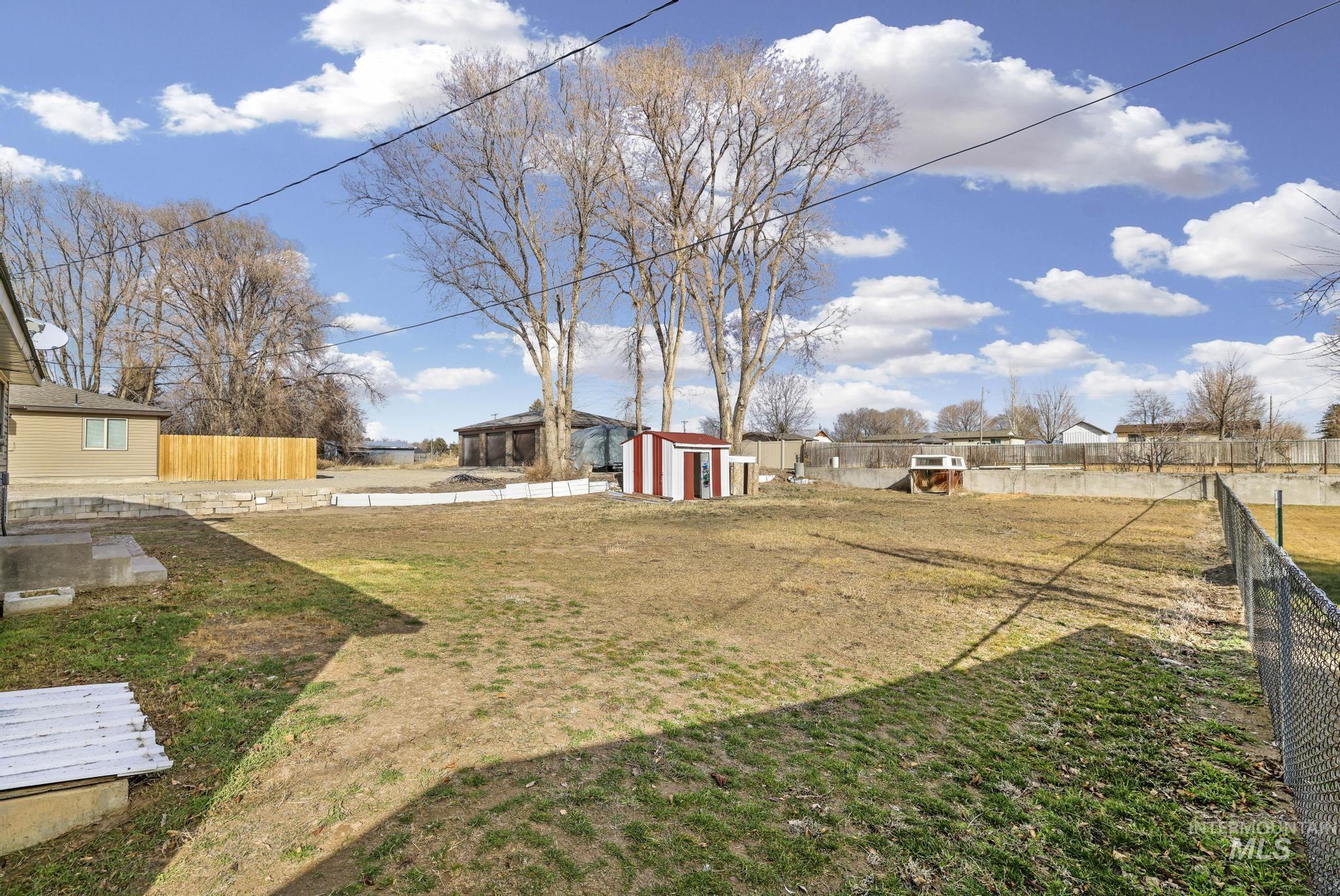1840 V Street Heyburn, ID 83336 - Photo 20 of 45 Fenced backyard with a storage shed