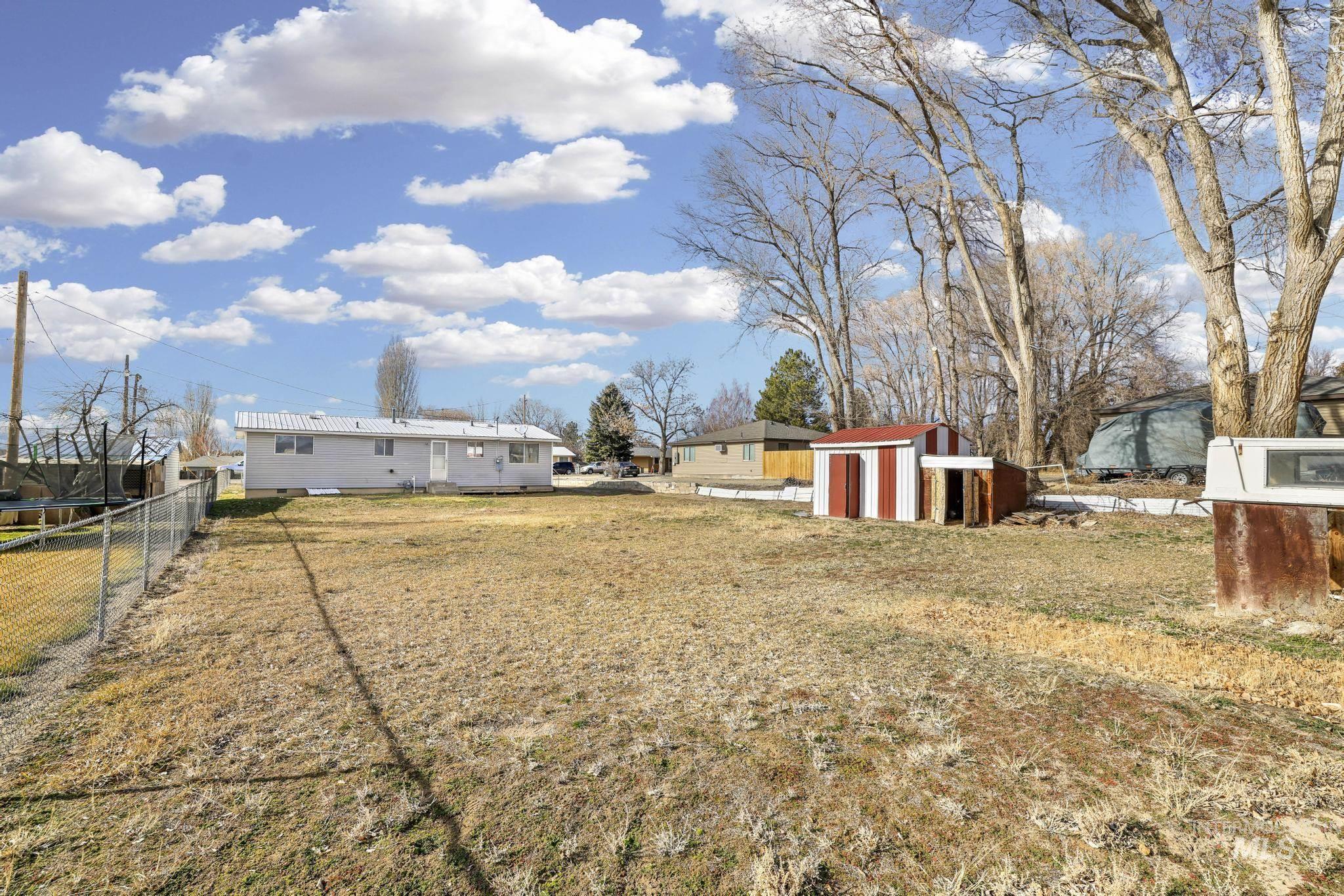 1840 V Street Heyburn, ID 83336 - Photo 21 of 45 Fenced backyard with a shed