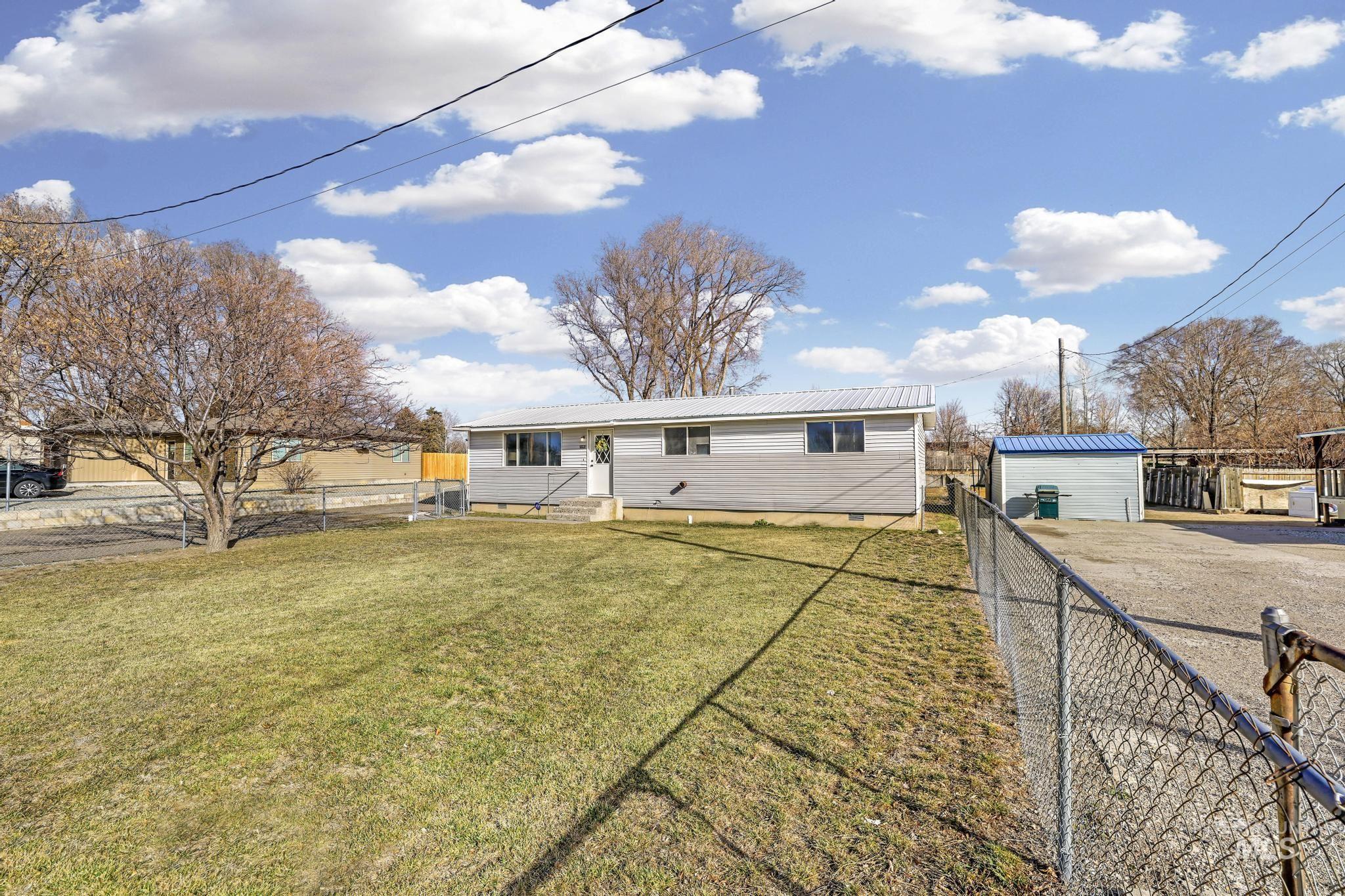 1840 V Street Heyburn, ID 83336 - Photo 24 of 45 View of front of home featuring a fenced backyard, crawl space, and a metal roof