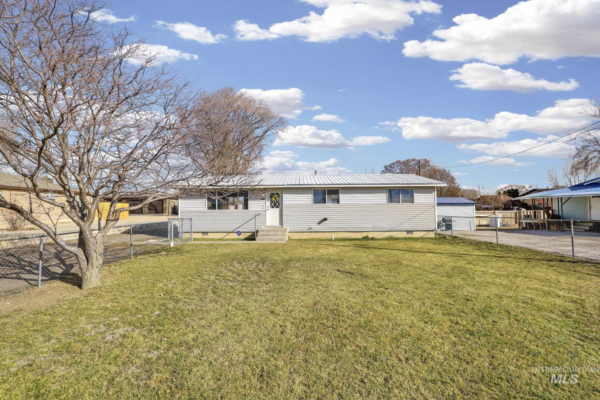 1840 V Street Heyburn, ID 83336 - Photo 25 of 45 View of front of property featuring crawl space, a metal roof, entry steps, and a garage
