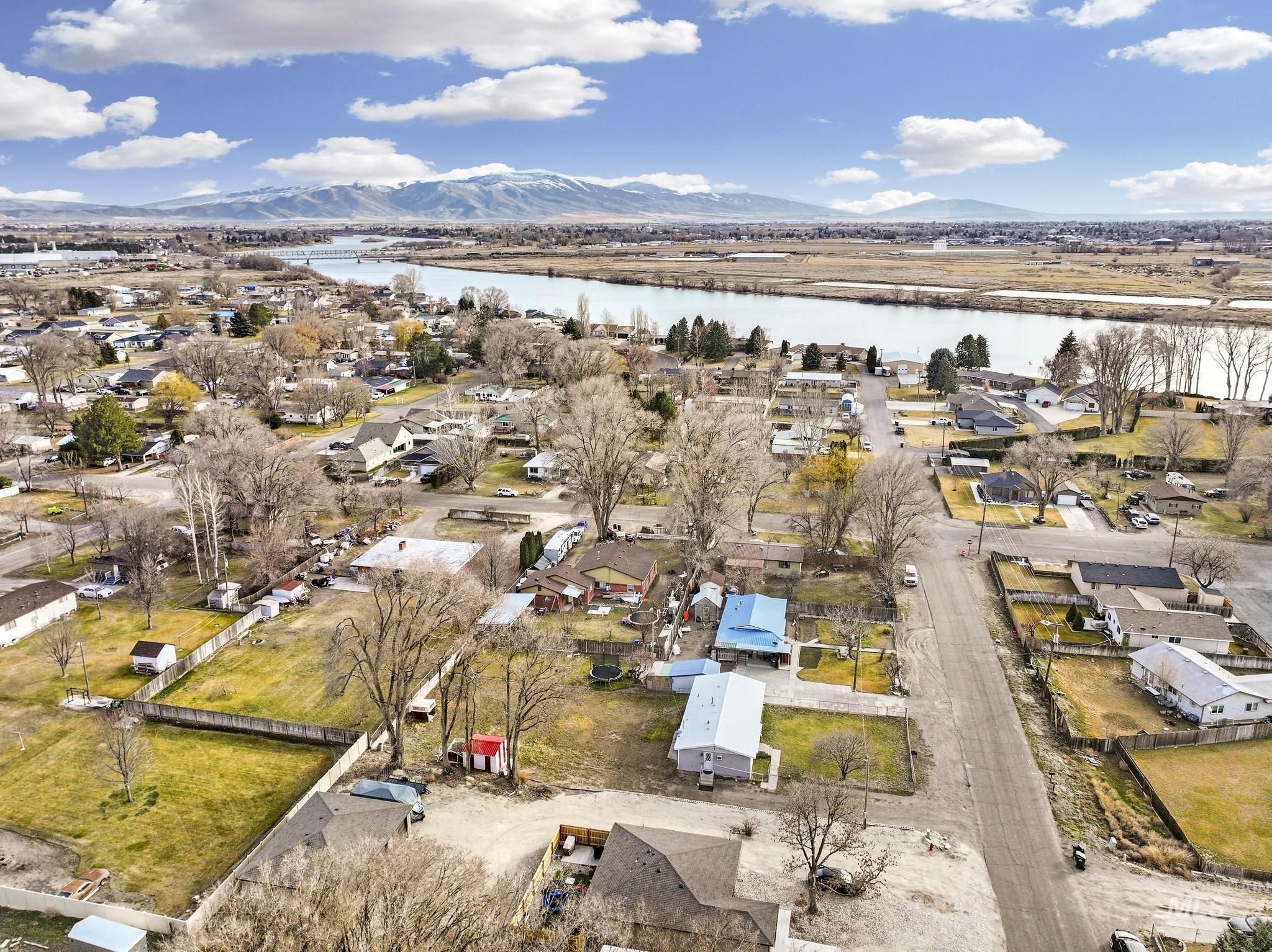 1840 V Street Heyburn, ID 83336 - Photo 40 of 45 Aerial view of property's location featuring nearby suburban area and a water and mountain view