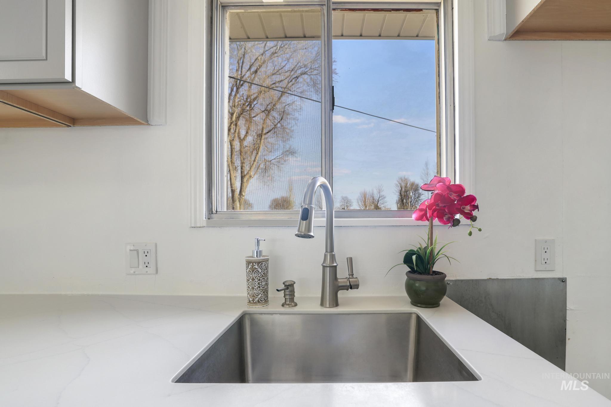 1840 V Street Heyburn, ID 83336 - Photo 6 of 45 Kitchen view of a sink and light stone counters