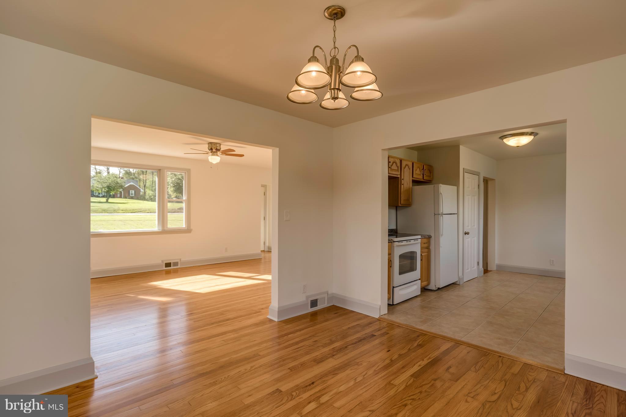 13327 Fork Road Baldwin, MD 21013 - Photo 7 of 23 Gleaming hardwood floors in the dining room