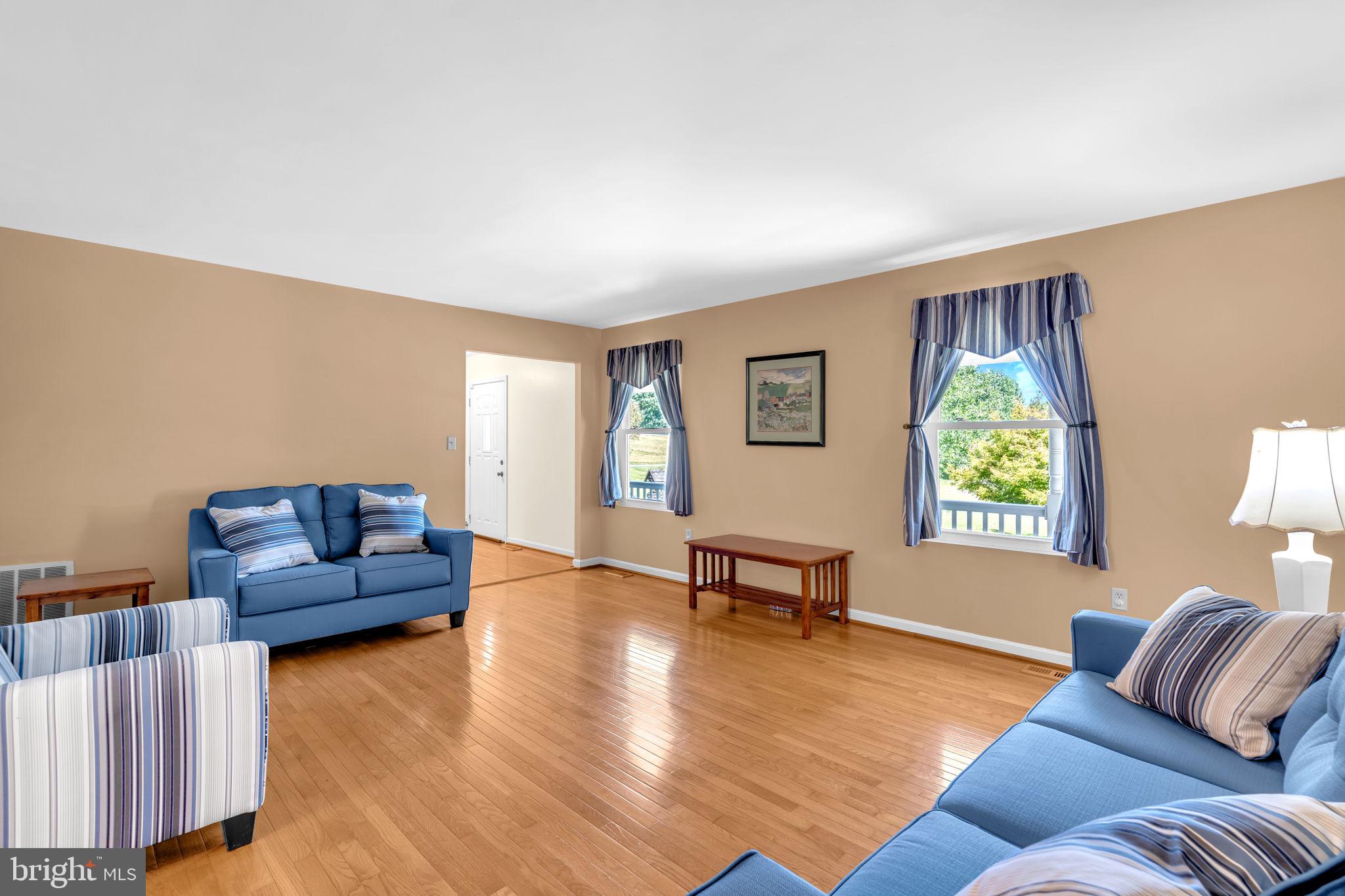 9788 Howes Road Dunkirk, MD 20754 - Photo 12 of 41 a living room with furniture and a flat screen tv