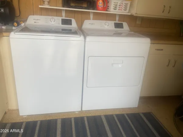 a utility room with dryer and washer