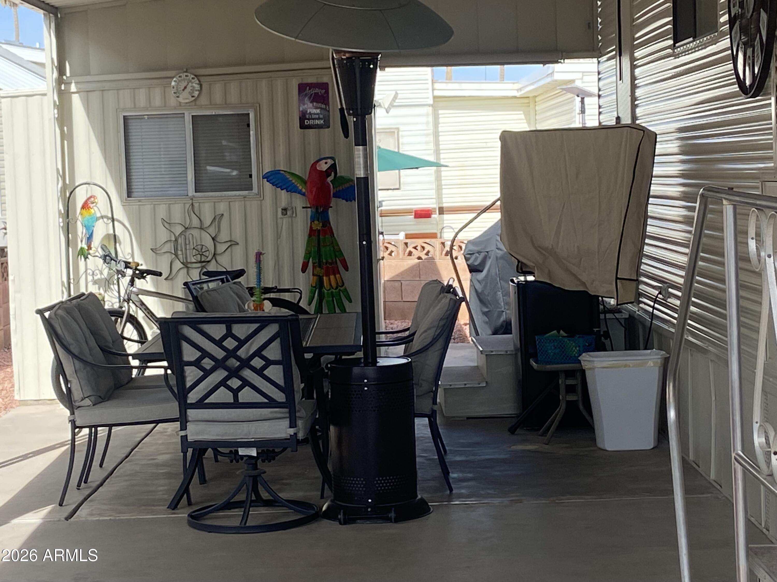 1340 West Inuit Avenue Apache Junction, AZ 85119 - Photo 22 of 30 a view of a dining room with furniture and window