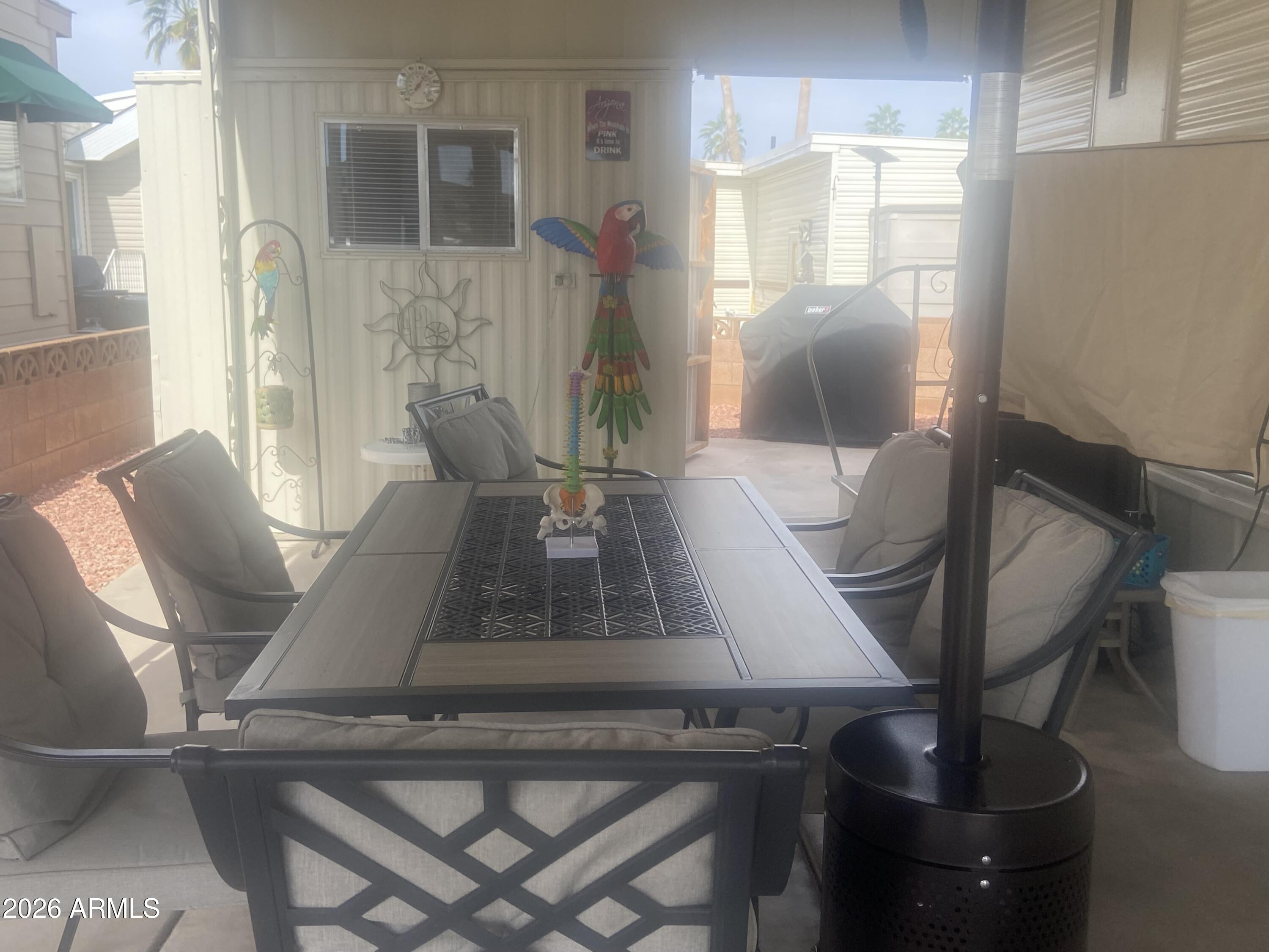 1340 West Inuit Avenue Apache Junction, AZ 85119 - Photo 24 of 30 a living room with furniture and a potted plant