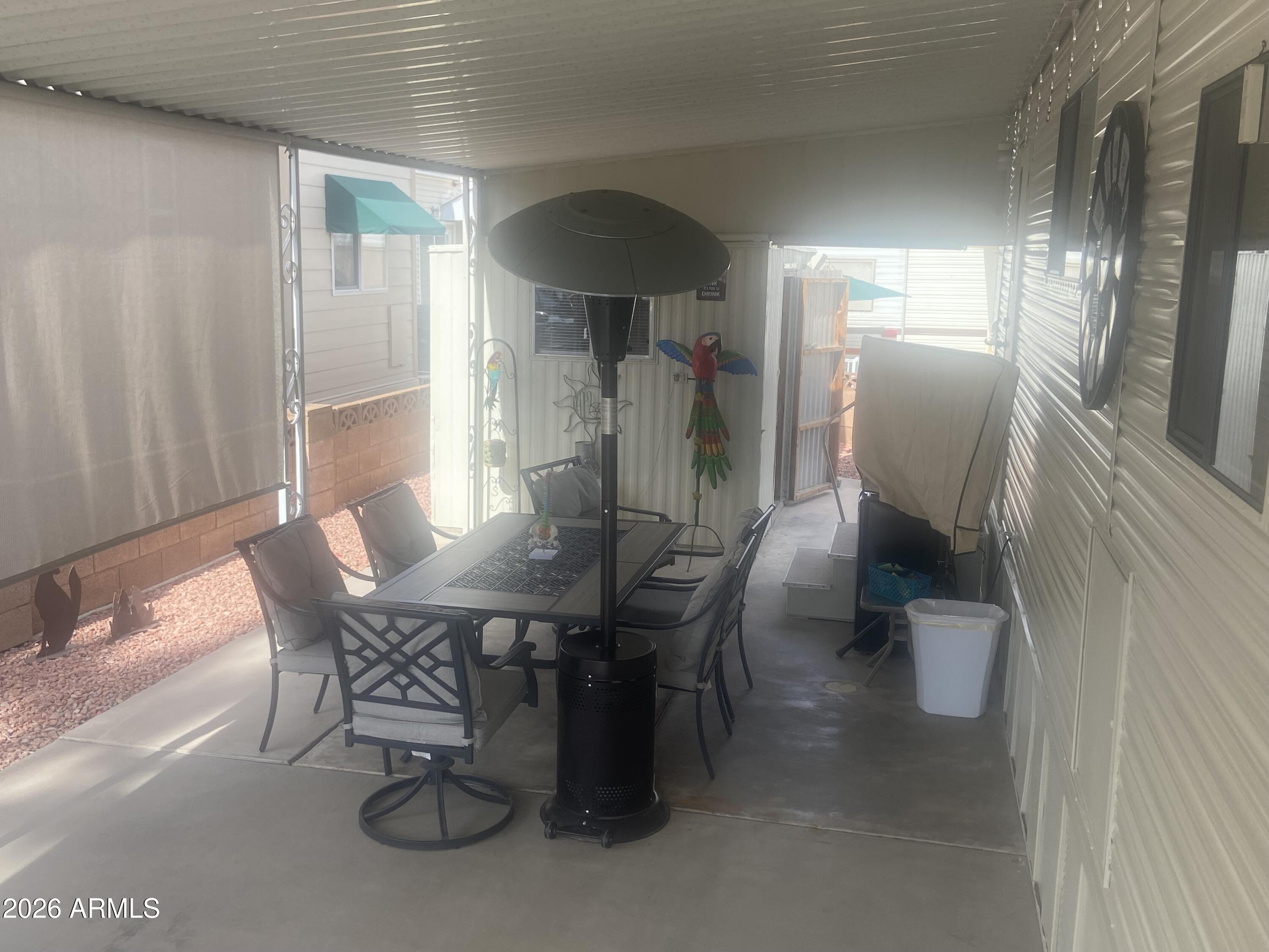 1340 West Inuit Avenue Apache Junction, AZ 85119 - Photo 26 of 30 a view of a dining room with furniture and chandelier