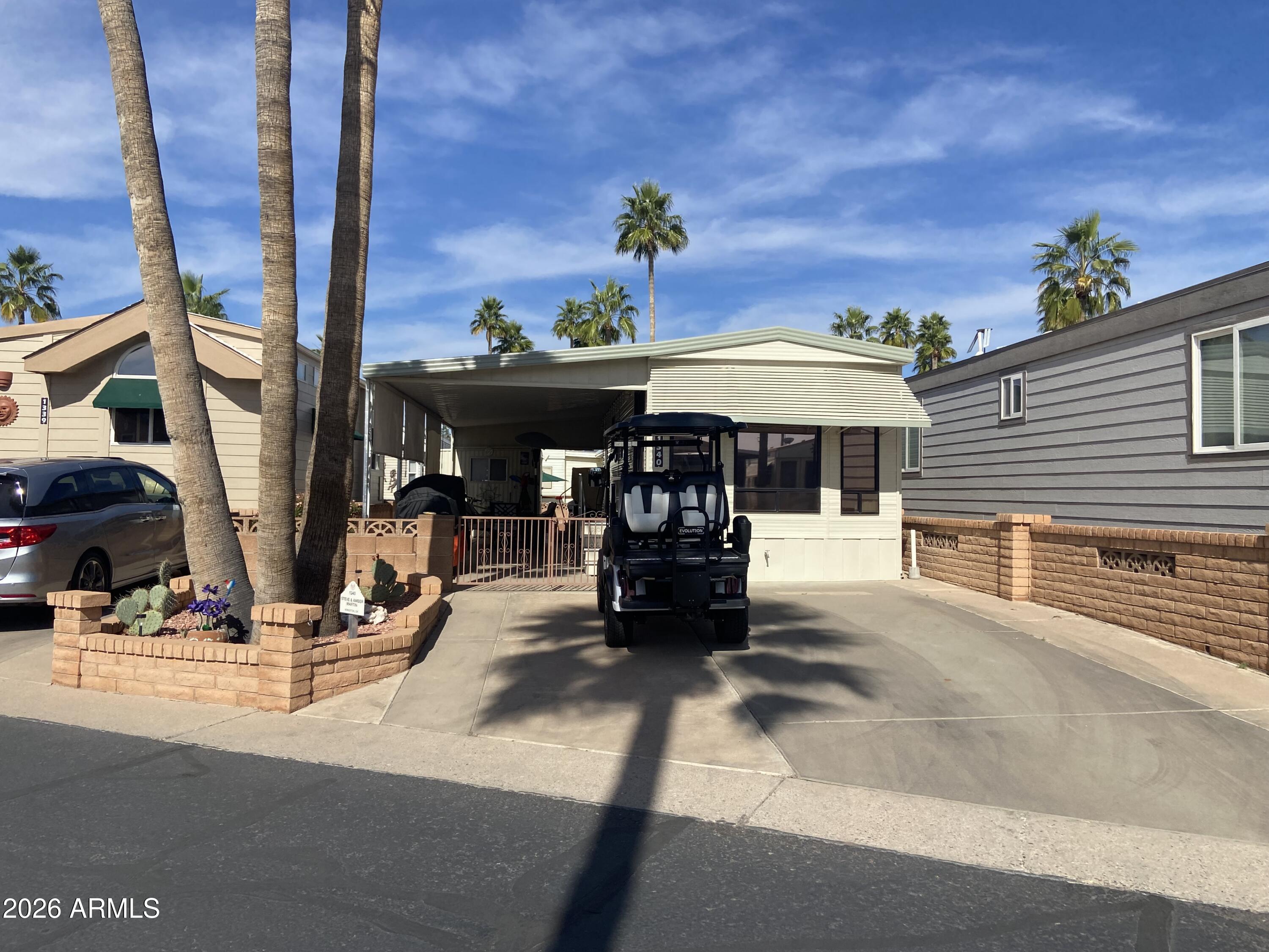 1340 West Inuit Avenue Apache Junction, AZ 85119 - Photo 27 of 30 a view of street with sitting area