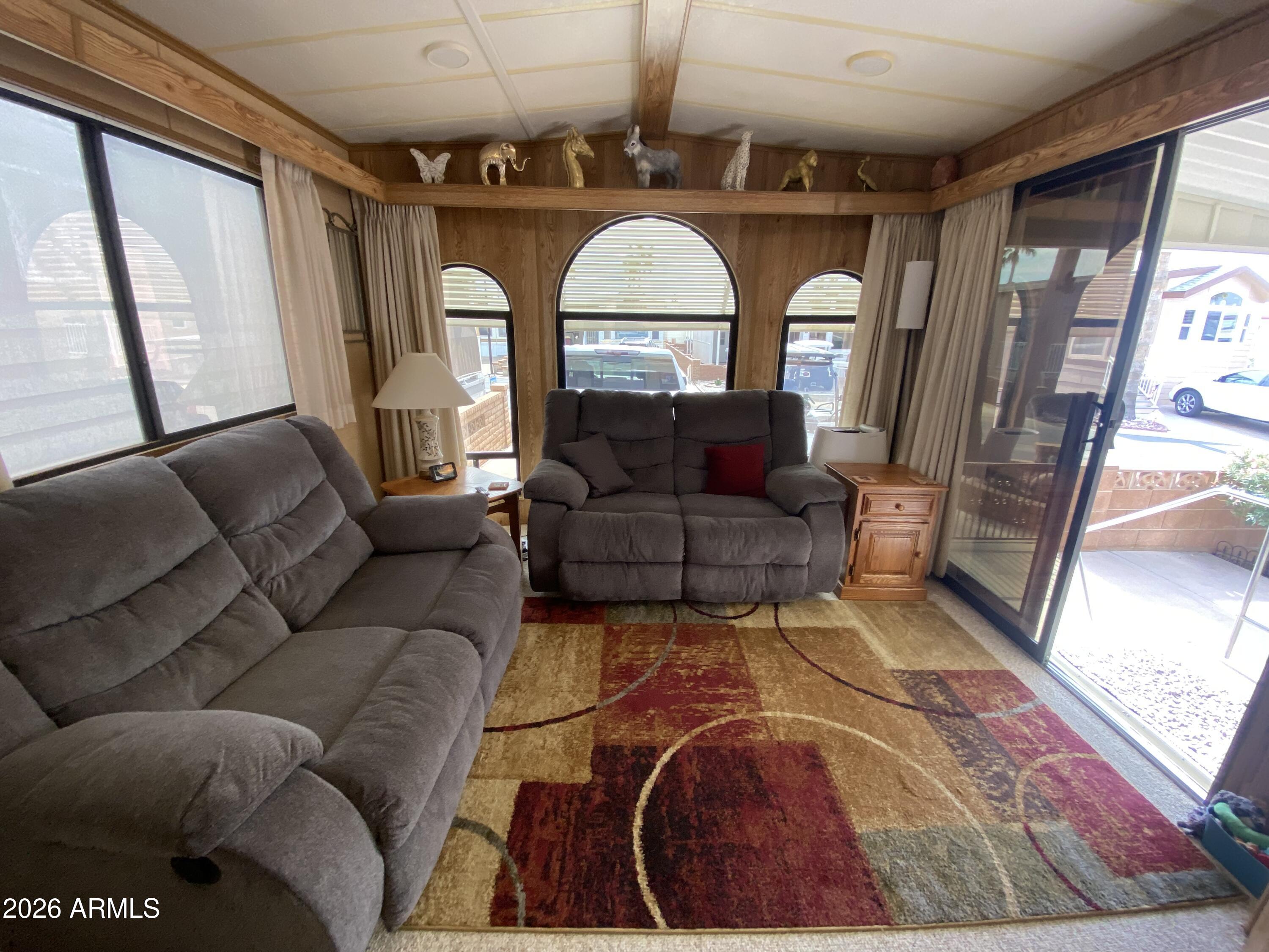 1340 West Inuit Avenue Apache Junction, AZ 85119 - Photo 3 of 30 a living room with furniture and a large window