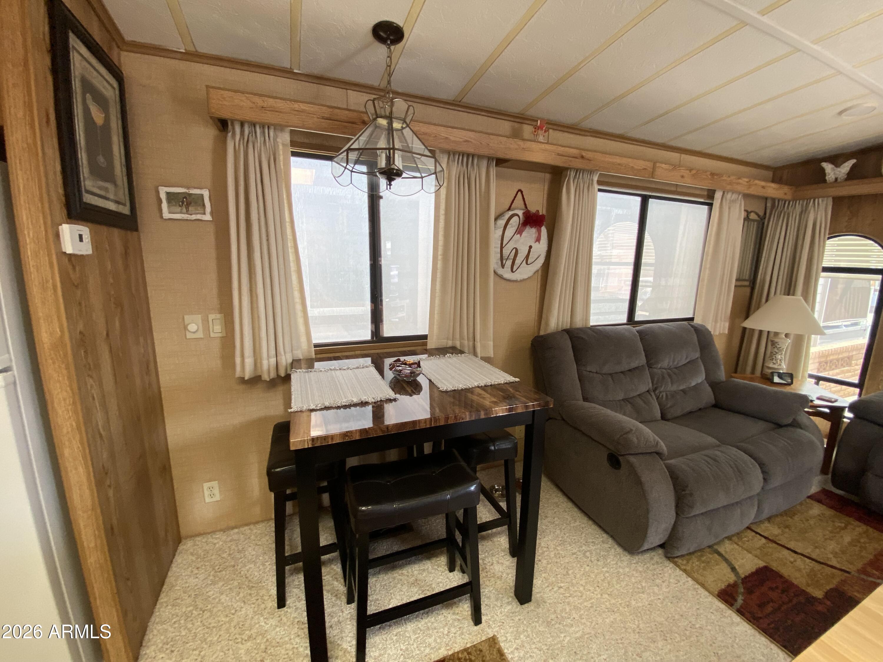 1340 West Inuit Avenue Apache Junction, AZ 85119 - Photo 4 of 30 a living room with furniture and a window
