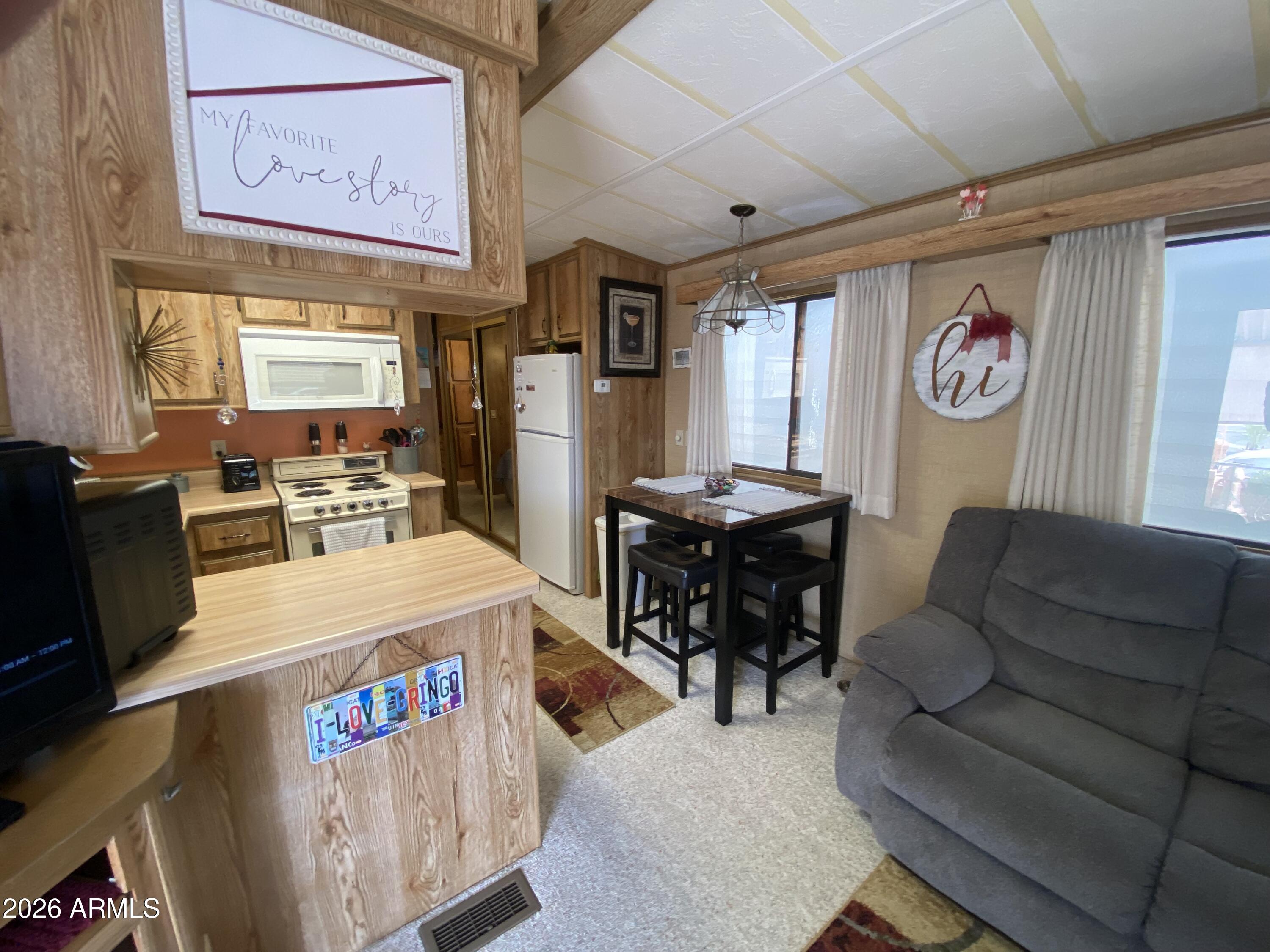 1340 West Inuit Avenue Apache Junction, AZ 85119 - Photo 5 of 30 a living room with furniture and a window