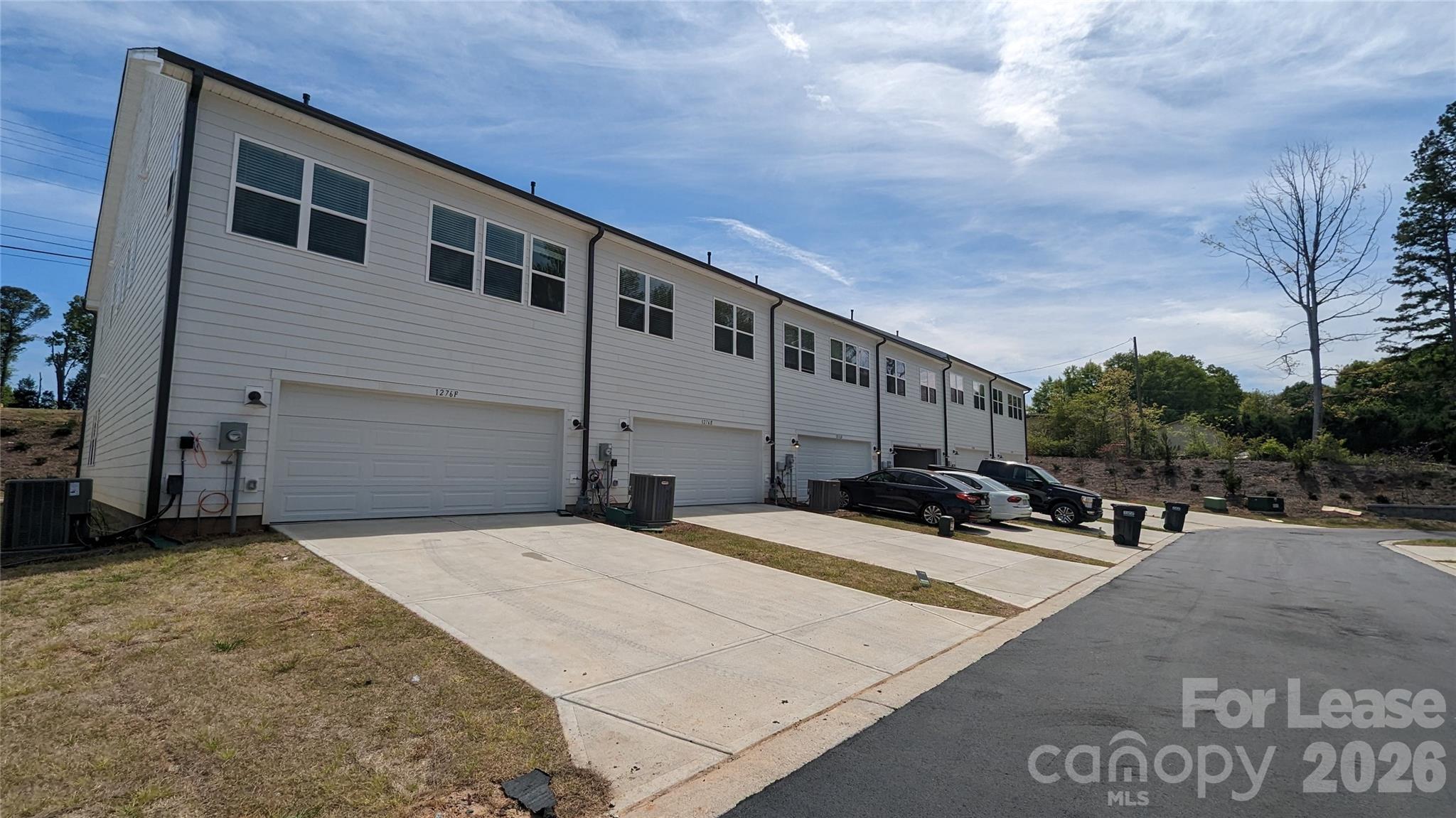 1276 Brawley School Road, Unit F Mooresville, NC 28117 - Photo 18 of 21 a view of a house with backyard and sitting area