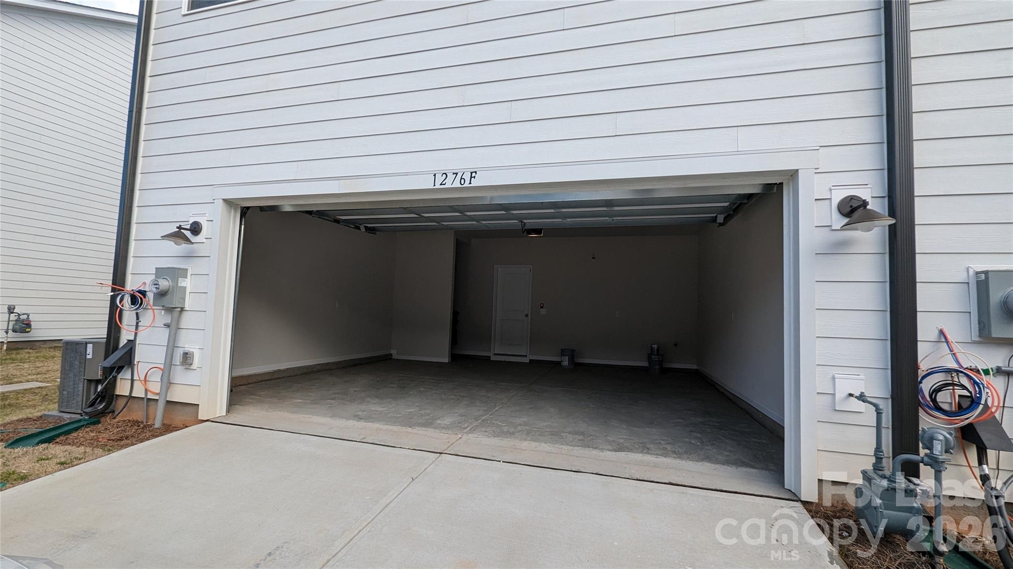 1276 Brawley School Road, Unit F Mooresville, NC 28117 - Photo 20 of 21 a stove top oven sitting inside of a kitchen