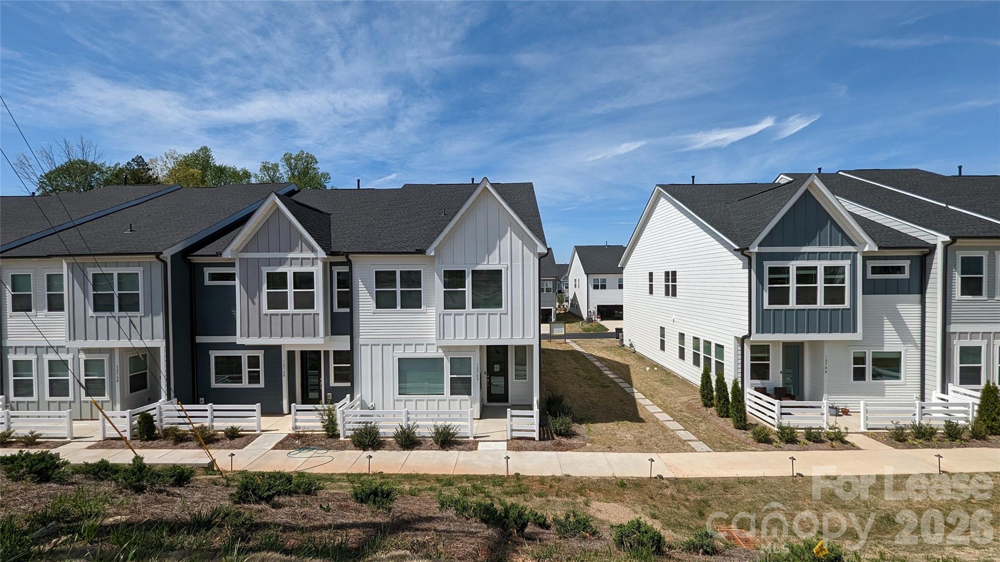 1276 Brawley School Road, Unit F Mooresville, NC 28117 - Photo 2 of 21 a front view of a house with a yard