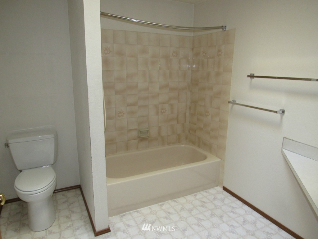1014 207th Place Southeast Bothell, WA 98012 - Photo 14 of 25 a bathroom with a toilet and a shower