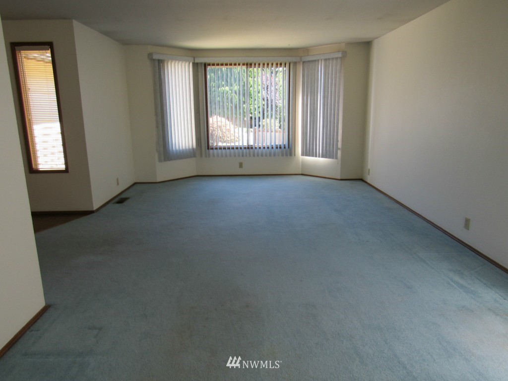1014 207th Place Southeast Bothell, WA 98012 - Photo 7 of 25 an empty room with windows