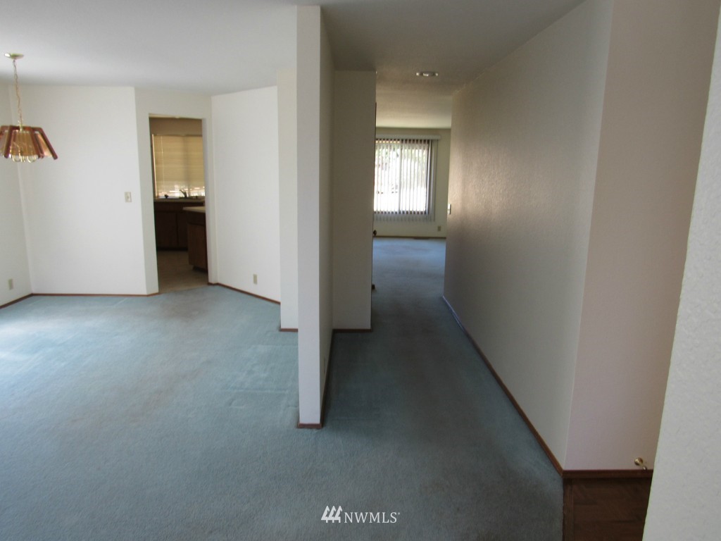1014 207th Place Southeast Bothell, WA 98012 - Photo 8 of 25 an empty room with windows