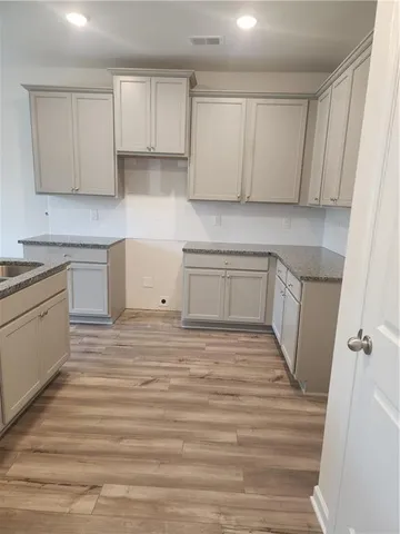 a kitchen with a sink and cabinets