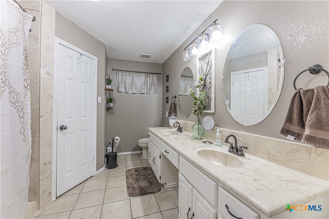 310 North 8th Street Nolanville, TX 76559 - Photo 17 of 31 Sleek Countertops and Stylish Faucets