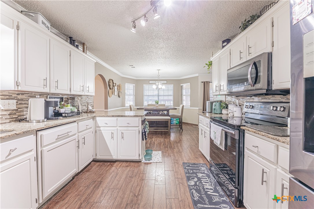310 North 8th Street Nolanville, TX 76559 - Photo 7 of 31 Updated Kitchen With White Cabinetry