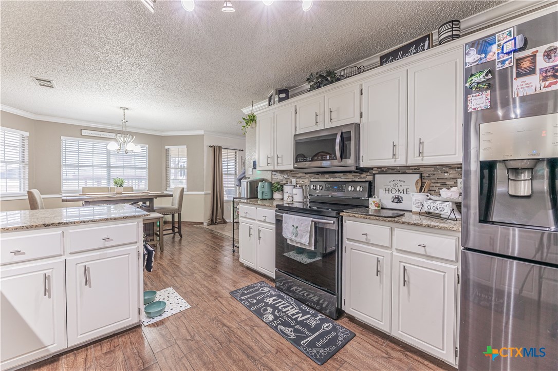 310 North 8th Street Nolanville, TX 76559 - Photo 9 of 31 Well Designed Kitchen With Stainless Appliances