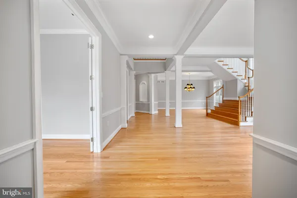 a view of a hallway with wooden floor