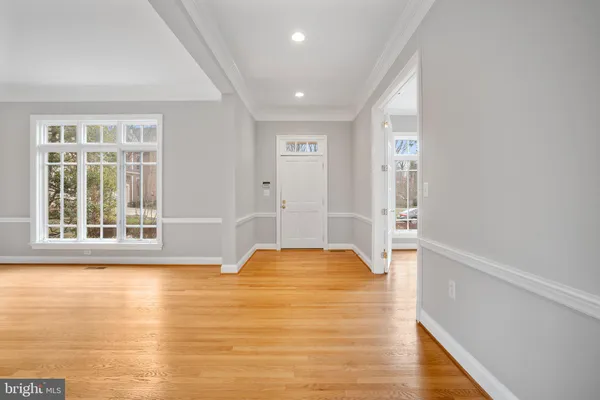 a living room with furniture a fireplace and a large window