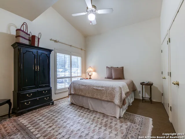 a bedroom with a bed and a closet