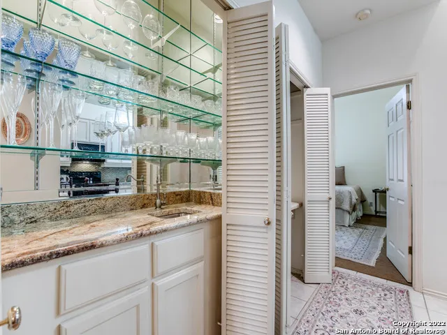 a kitchen with a sink and a counter top space