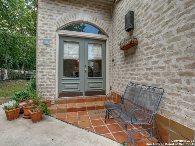 a front view of a house with outdoor seating