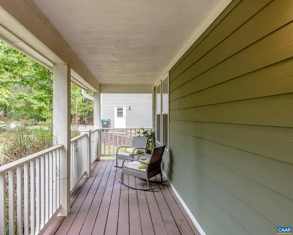 a view of a balcony with chairs