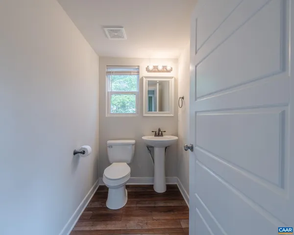 a bathroom with a toilet and a sink