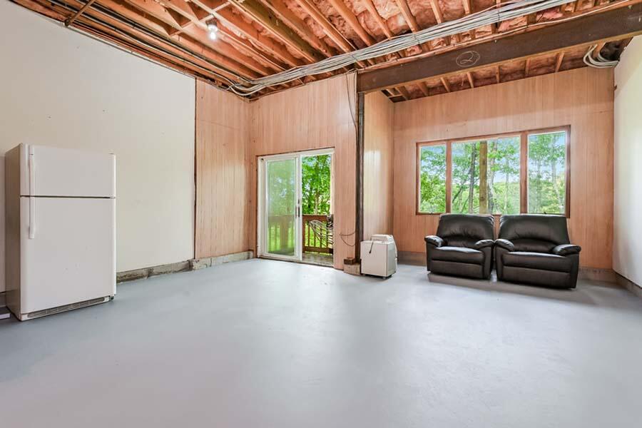 15 Riverview Avenue, Unit B Mashpee, MA 02649 - Photo 21 of 28 a living room with furniture and a large window