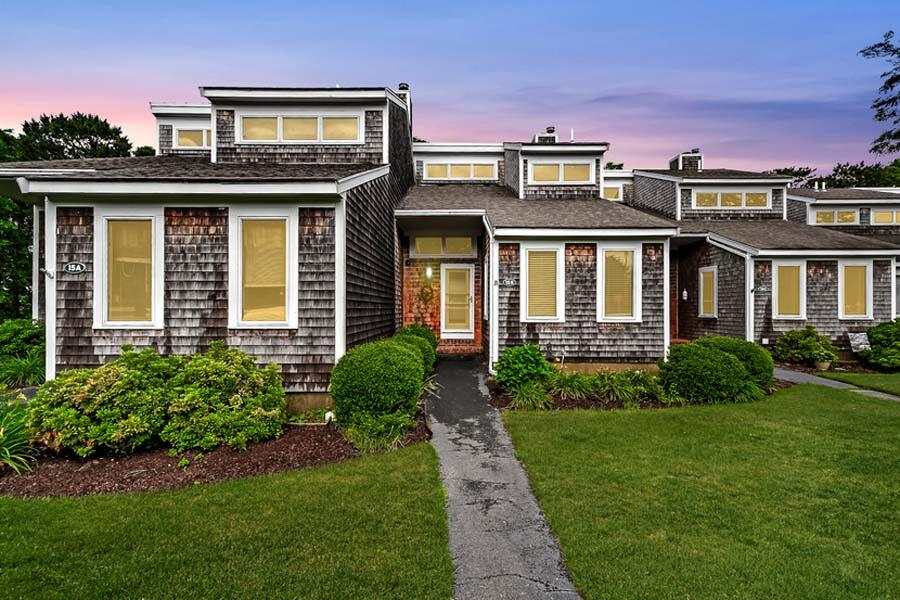 15 Riverview Avenue, Unit B Mashpee, MA 02649 - Photo 25 of 28 a front view of a house with a yard