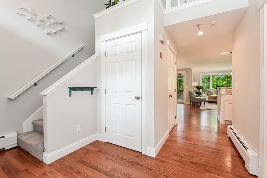 15 Riverview Avenue, Unit B Mashpee, MA 02649 - Photo 3 of 28 a view of a hallway view with wooden floor and staircase