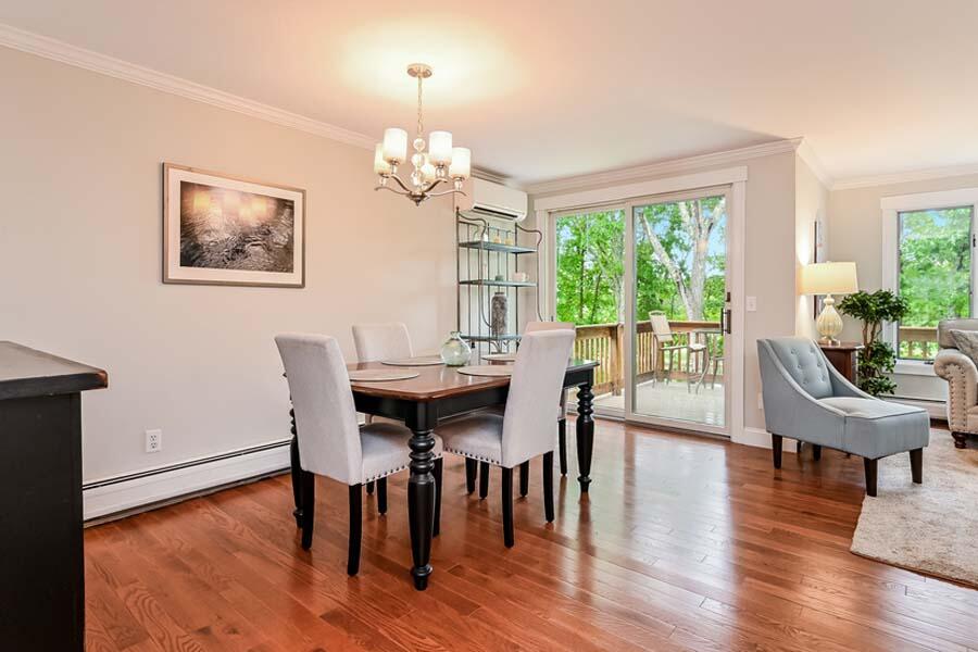 15 Riverview Avenue, Unit B Mashpee, MA 02649 - Photo 7 of 28 a view of a dining room with furniture window and wooden floor