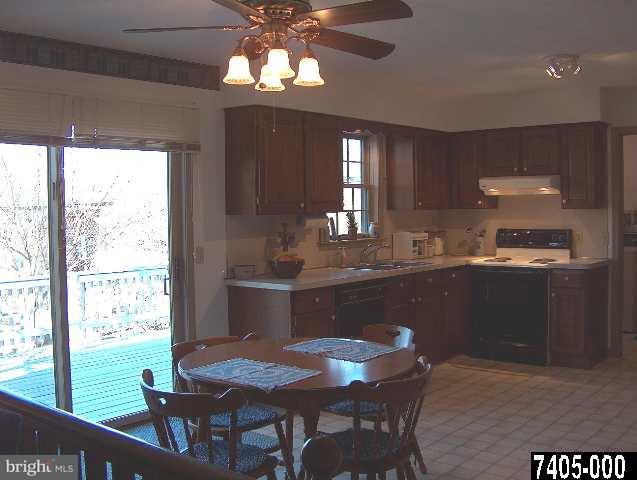 2760 Stoverstown Road, Unit 5 Spring Grove, PA 17362 - Photo 3 of 9 a kitchen with a table and chairs in it