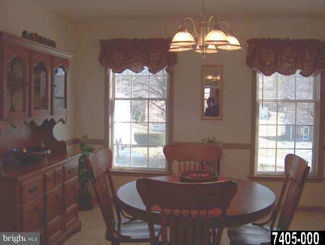 2760 Stoverstown Road, Unit 5 Spring Grove, PA 17362 - Photo 4 of 9 a dining room with furniture and window